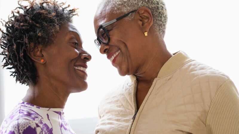 Smiling women looking into eyes