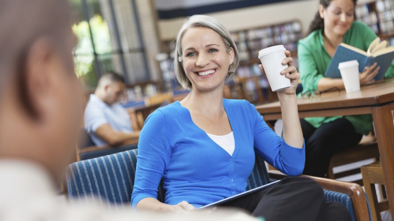 localaarp brain smiling woman with coffee cup in classroom