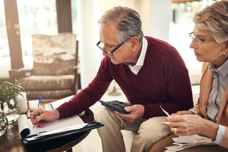 Couple writing on notepad