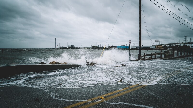 Water crashing over bridge during Hurricane