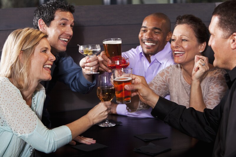 Group of friends having drinks at restaurant