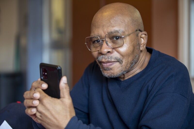 A resident uses WiFi in a JCHA public housing development.