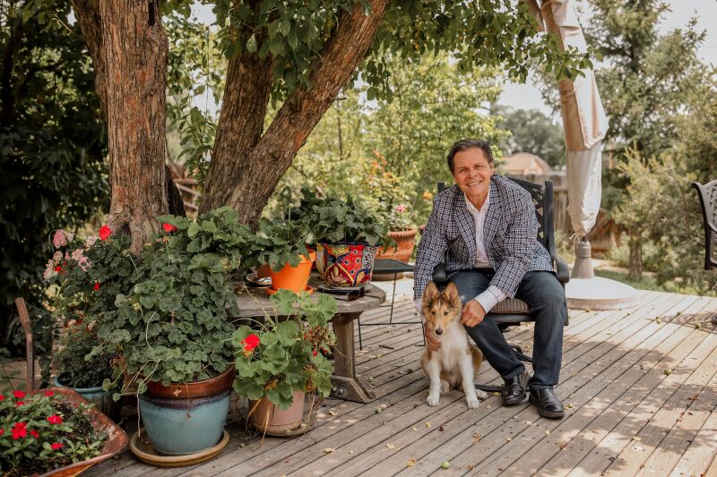 André García-Nuthmann at home with his pup.