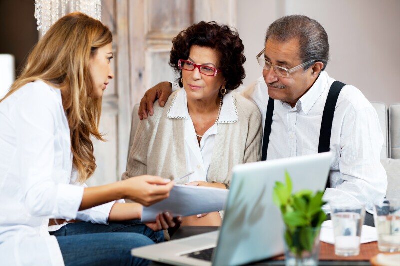 Senior couple meeting with financial advisor.