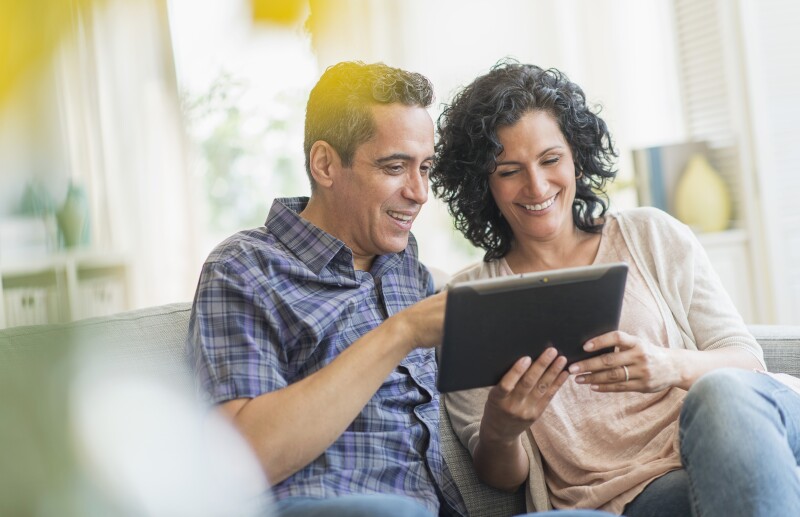 USA, New Jersey, Jersey City, Couple using digital tablet together