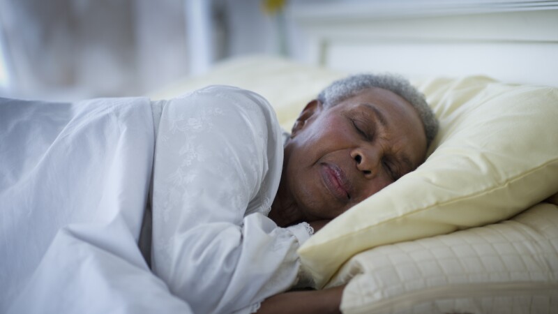 Black woman sleeping in bed