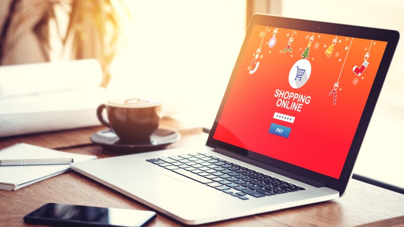 online shopping website on laptop screen for buy gift on seasonal and holiday for Christmas and new year gift. online shopping concept