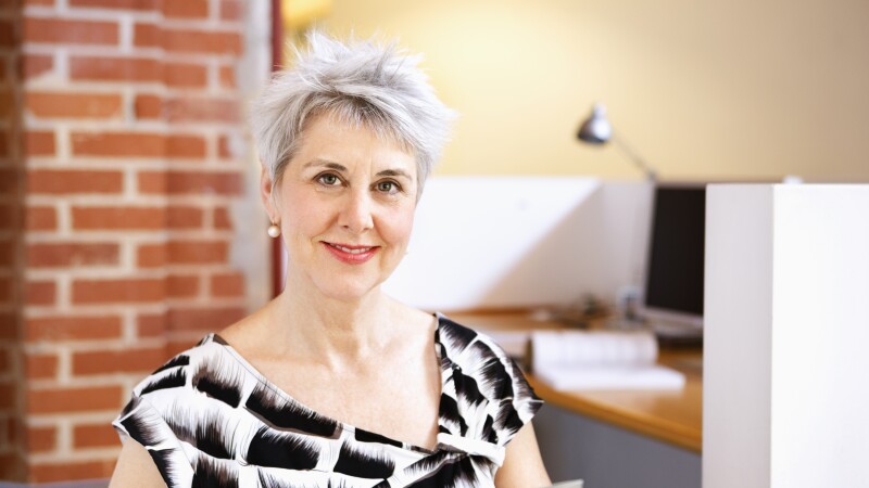 Portrait of smiling, mature business woman