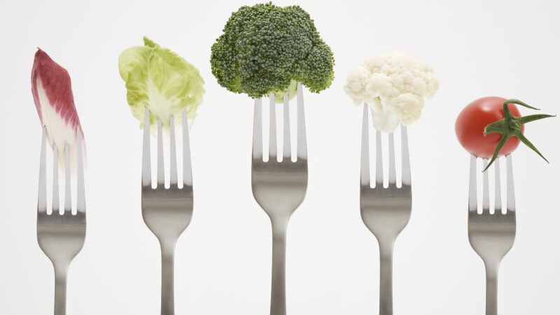 Close up of vegetables on forks