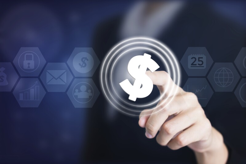 Business women holding posts in dollar signs ($).