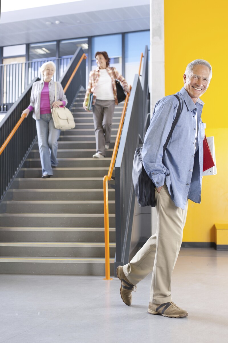 Adult students in college arriving for evening classes