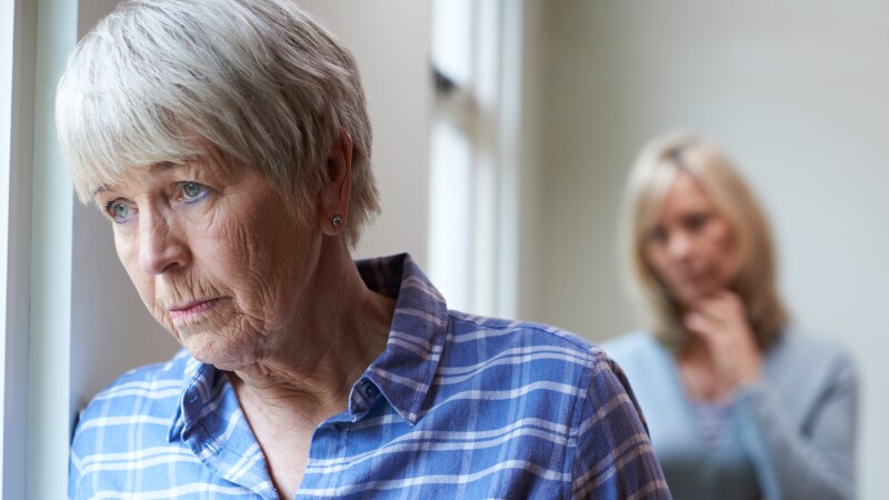 Serious Senior Woman With Adult Daughter At Home