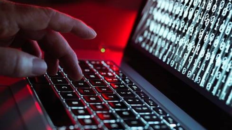 photo of someone typing on a laptop