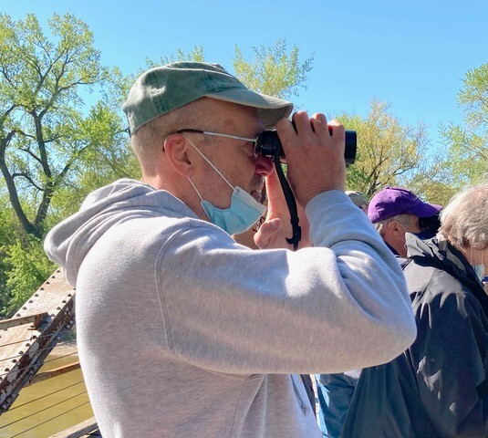 Dennis leads a group bird watching