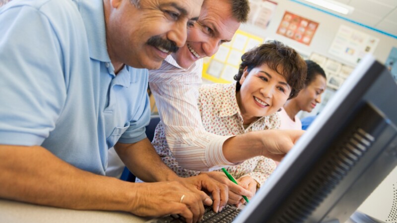 Mature students learning computer skills