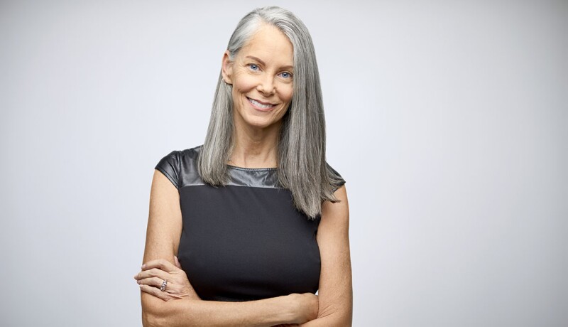 Portrait of confident mature businesswoman smiling