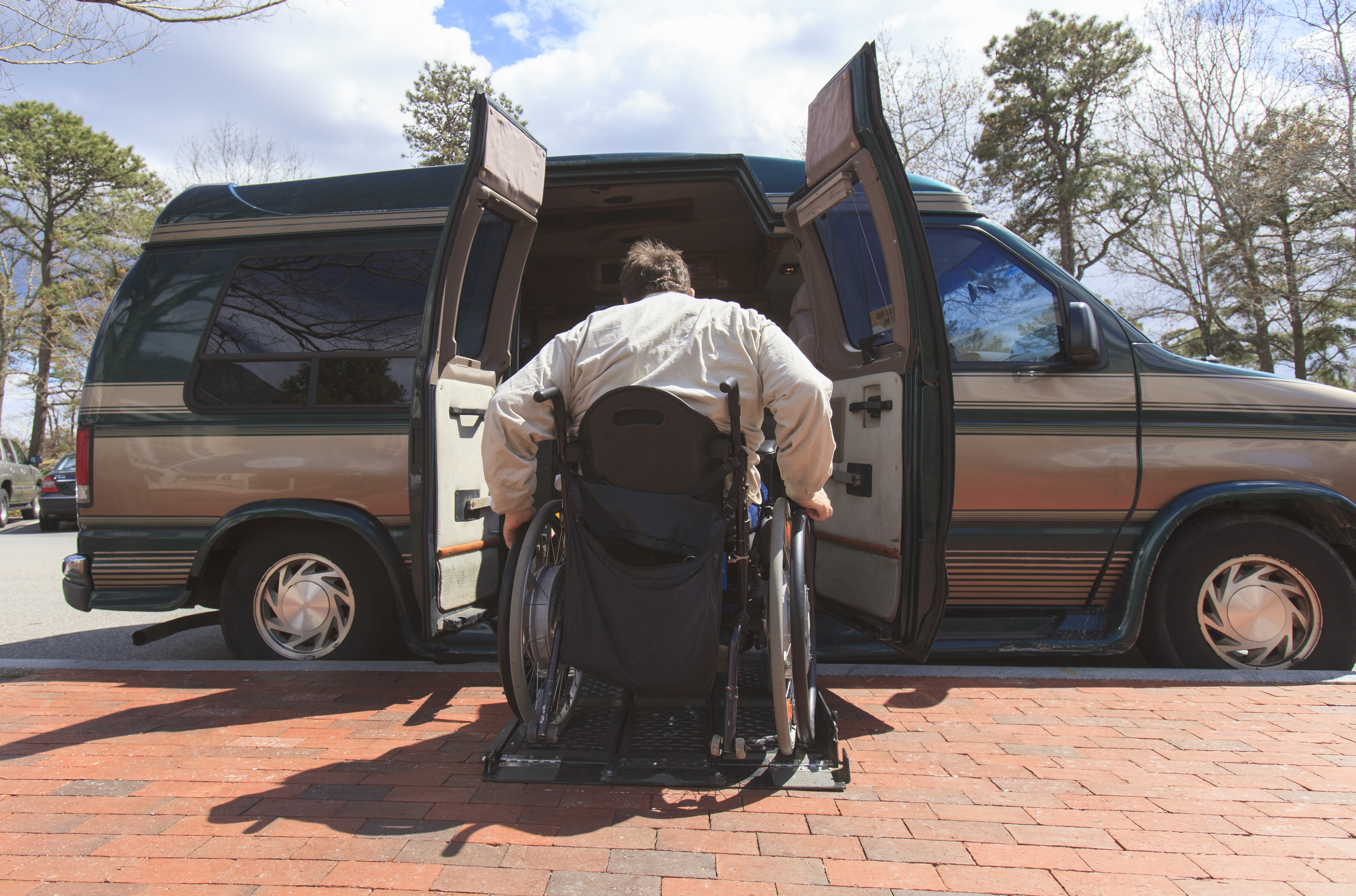 Man with Spinal Cord Injury entering his accessible van