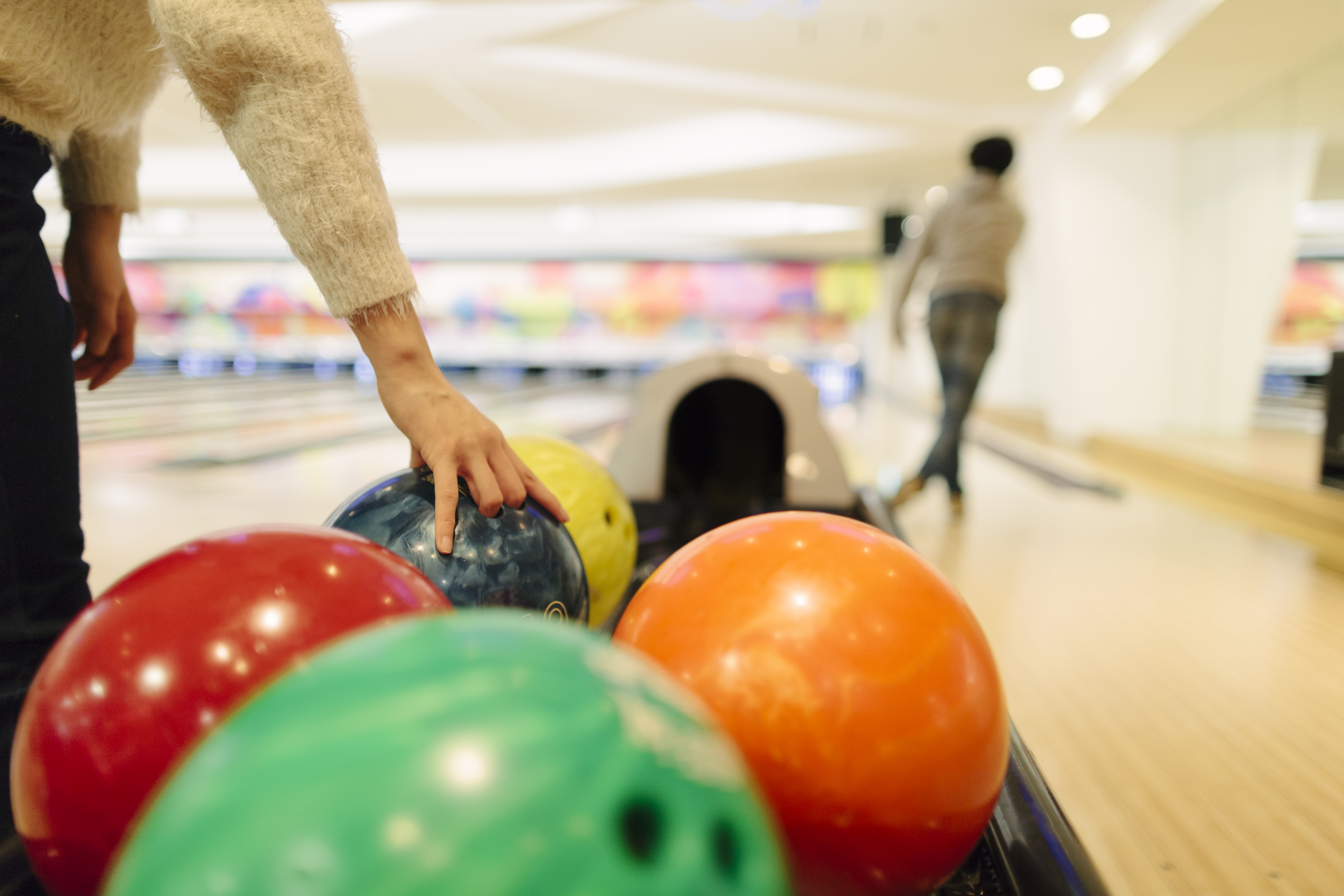 Two people playing bowling