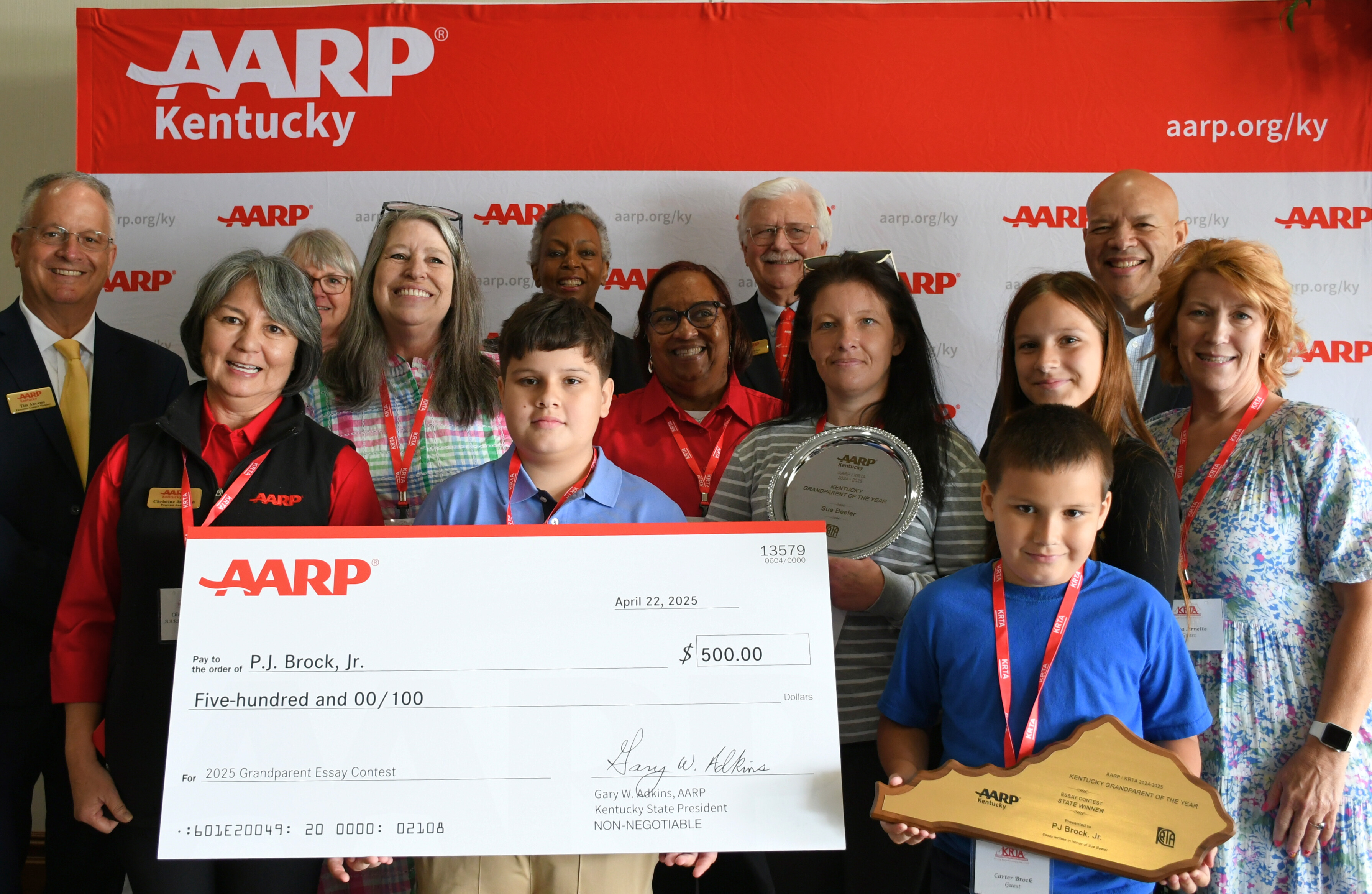 Essay contest winner and family with KRTA and AARP Kentucky