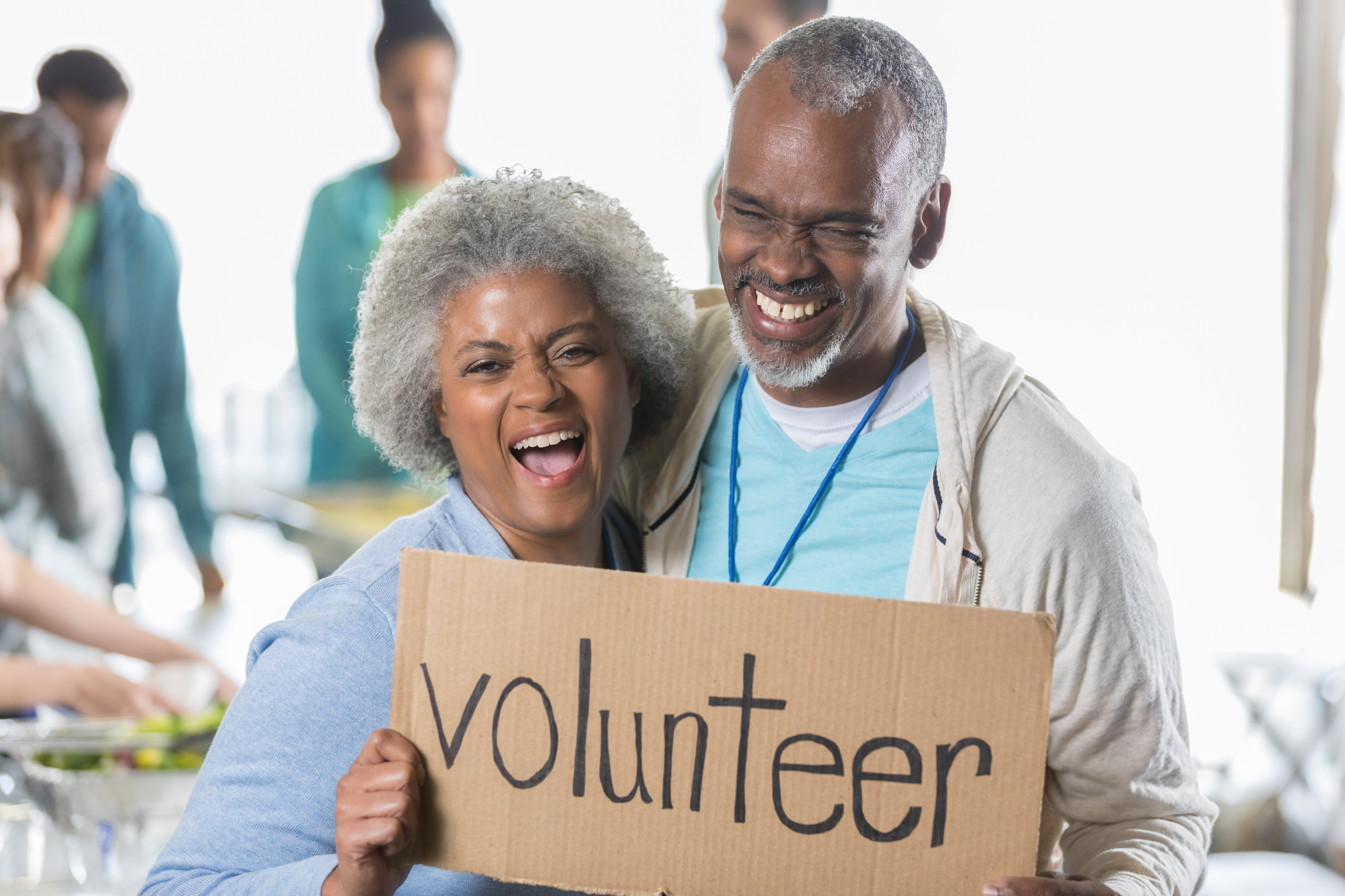 Active senior couple volunteer during food drive