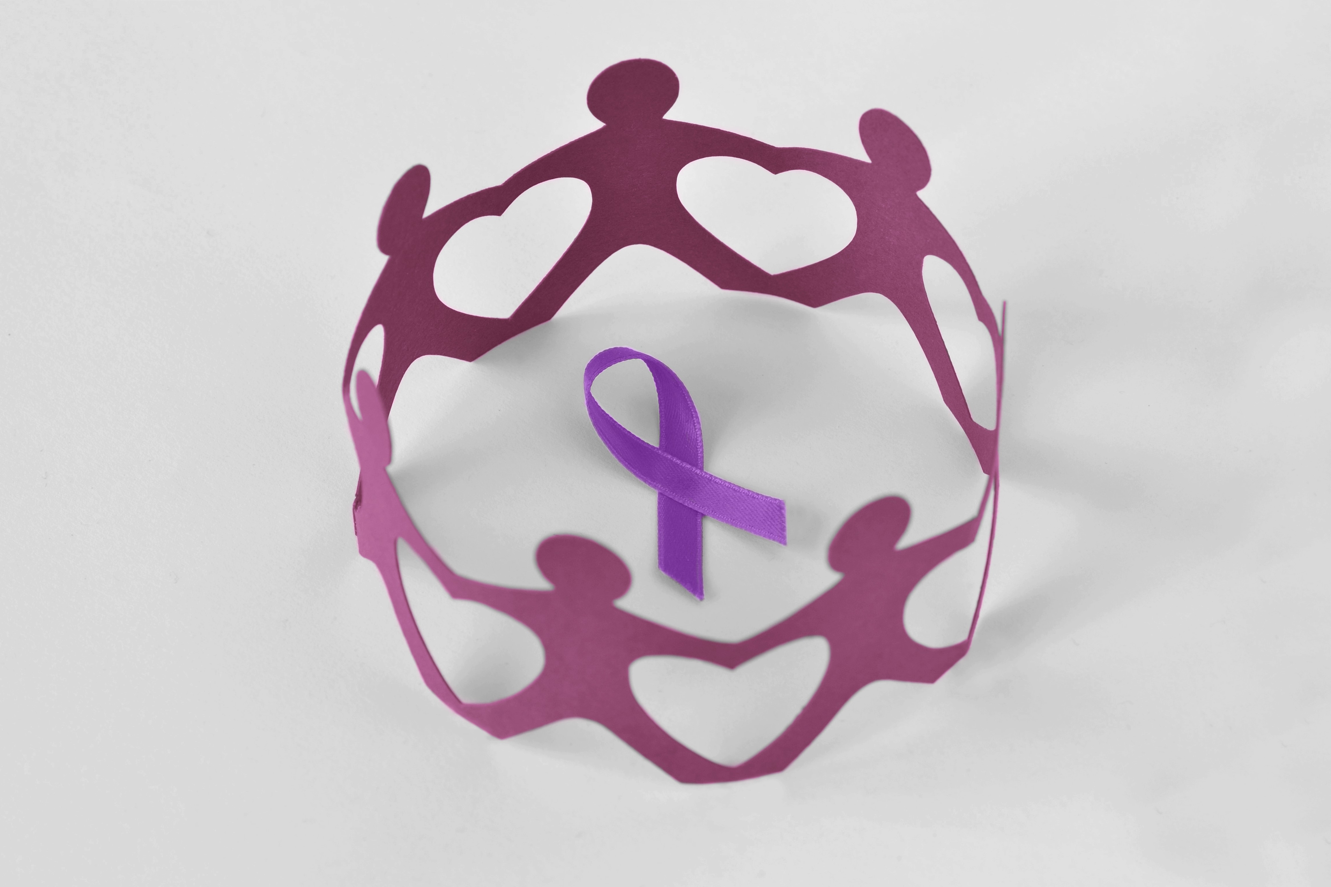 Paper people in a circle around violet ribbon on white background - Concept of Domestic Violence awareness; Alzheimer's disease, Pancreatic cancer, Epilepsy awareness and Hodgkin's Lymphoma