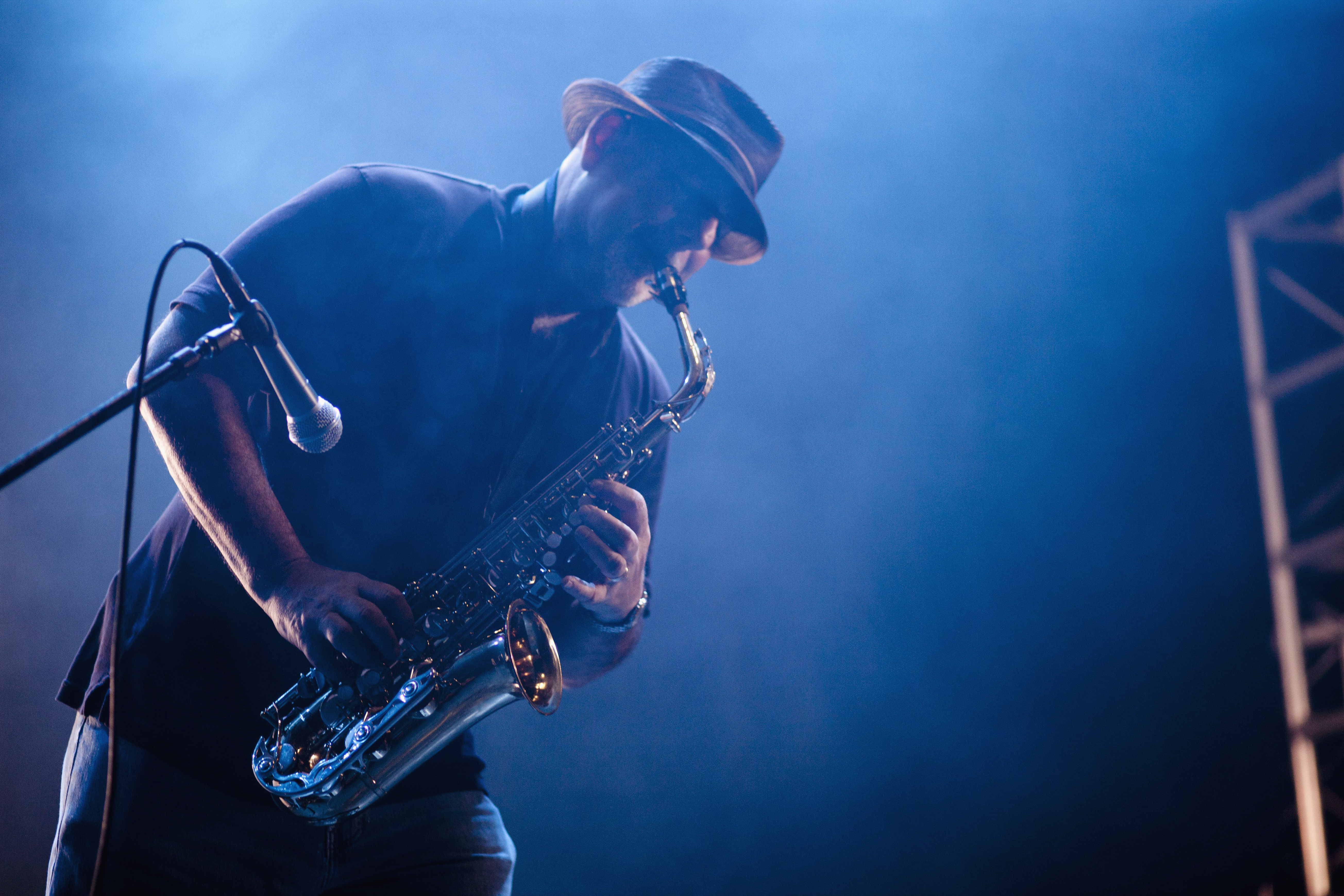 Musician playing saxophone on stage