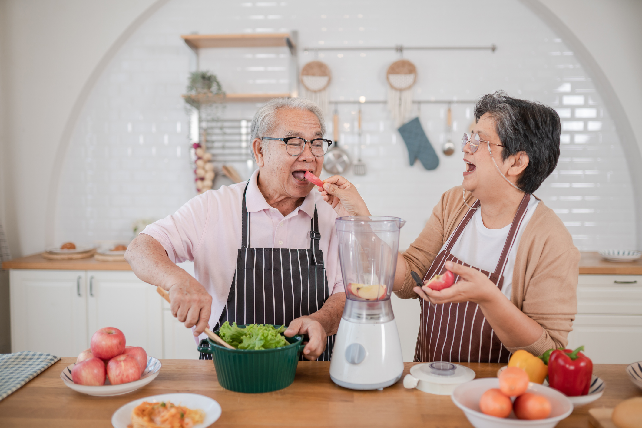 Asian senior couples love cooking in a modern kitchen together