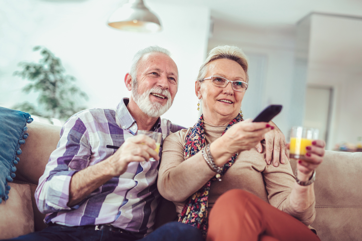 Senior couple watching TV