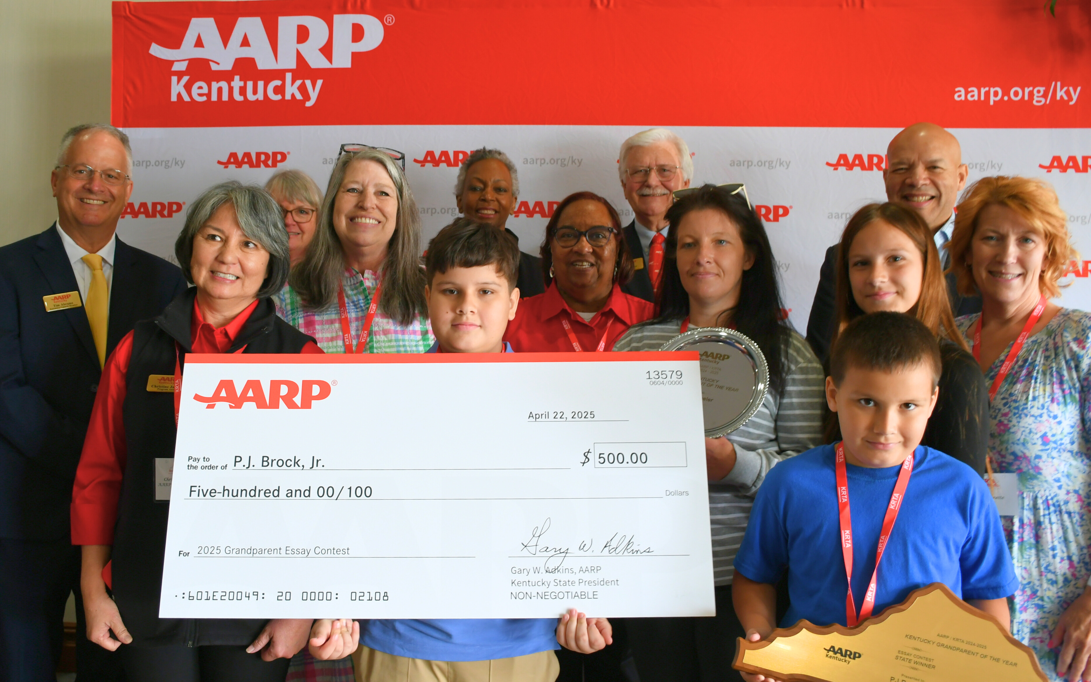 Essay winner family with KRTA and AARP Kentucky