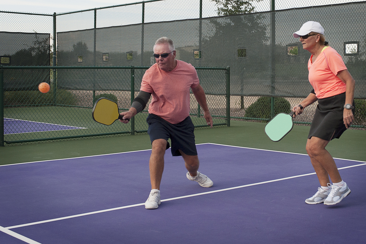 Mixed Doubles Pickleball Action - Smooth Backhand